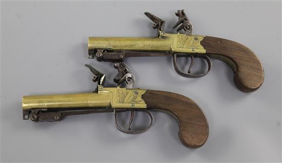 A pair of brass framed and barrelled flintlock boxlock pocket pistols, 8in. (11in with bayonet)